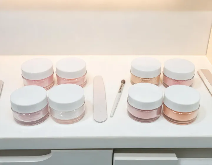 gel builder vs dip powder on a cosmetics bench, illustration only